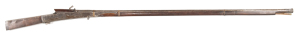 INDIAN MATCHLOCK WALL GUN: 10 bore; 68" iron barrel with an ornate flared muzzle & secured by 3 brass bands, one absent; Indian script to the breech; serpentine lock, bent match holder; vg profiles & clear script; silver grey patina to barrel & side plate