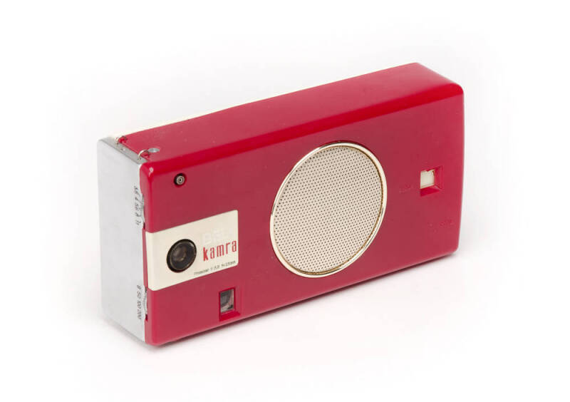 BELL INTERNATIONAL CORP. (U.S.A.): Bell Kamra Model KTC-62, c1959 combination 16mm cassette camera and pocket-sized transistor radio in red [#10724]. With original leather case and strap, instruction leaflet, headphone and box.