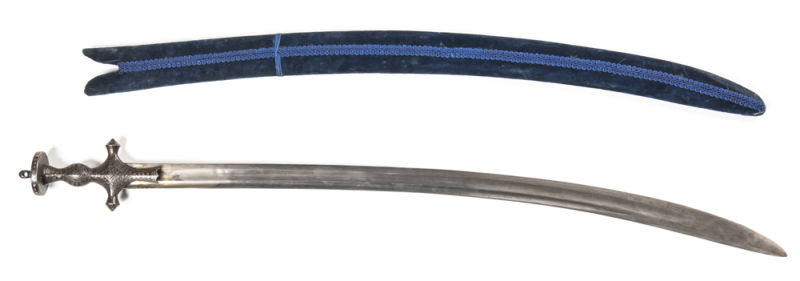 INDIAN TULWAR: vg cond 31" watered steel double fullered blade, 9" back edge; faint maker's mark; traditional open hilt & disc fully decorated with silver koftgari with traces of gold; complete with dark blue velvet over wood scabbard in g. cond. Ear