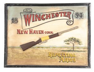 WINCHESTER SHOP DISPLAY BOARD: 24”x 32”; depicting Winchester in a banner, marked 1894 & NEWHAVEN CONN REPEATING ARMS; with super imposed Winchester rifle on a hand painted rural background with a view of the mountains. Great for a man cave.