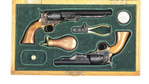 CASED PAIR OF UBERTI COLT 1849 PERCUSSION REVOLVERS: 1. POCKET NAVY: 36 Cal; 5 shot rebated cylinder with all scene intact; 165mm (6½") octagonal barrel; g. bore; standard sights & fittings; 96% blue finish to barrel & cylinder; vivid case colours to fram