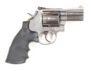 SMITH & WESSON MODEL 686-4 STAINLESS STEEL C/F REVOLVER: 357 Magnum; 6 shot fluted cylinder; 63mm (2½") barrel; vg bore; standard sights; S&W & Cal markings to barrel; S&W Trademark to lhs of frame, rhs MADE IN USA & address; sharp profiles & clear addres