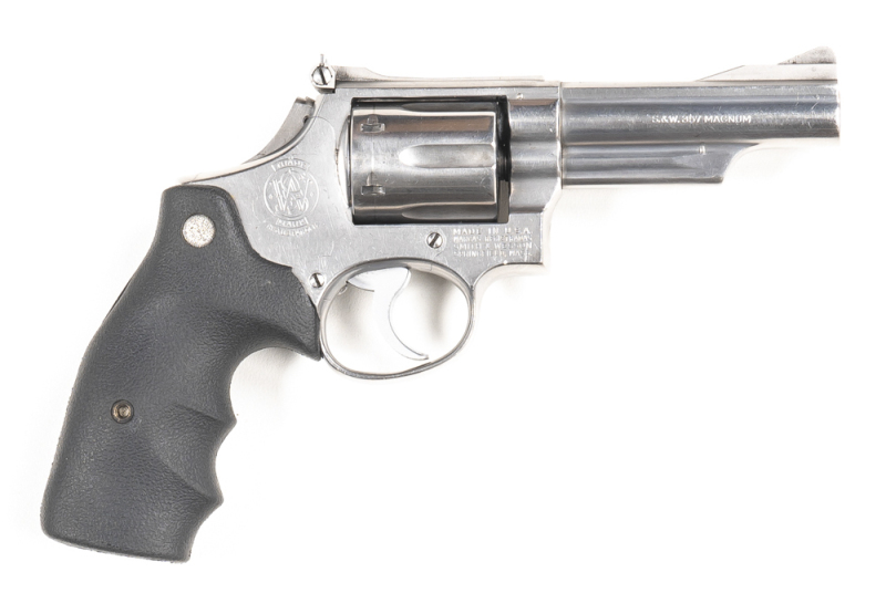 SMITH & WESSON MODEL 66 COMBAT MAGNUM STAINLESS STEEL C/F REVOLVER: 357 Magnum; 6 shot fluted cylinder; 102mm (4") barrel; vg bore; S&W & Cal markings to barrel; Trademark & MADE IN USA & address to rhs of frame; vg profiles, clear markings; lightly polis