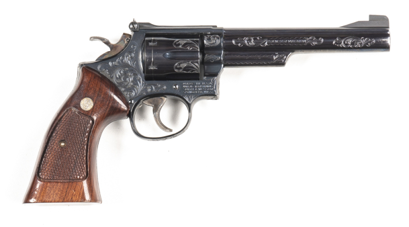 SMITH & WESSON MODEL 19-4 COMBAT MAGNUM C/F REVOLVER: 357 Magnum; 6 shot cylinder with scroll engraving between the flutes; 153mm (6") barrel; vg bore; standard sights; S&W & Cal marking to barrel, Trademark to lhs of frame; 90% coverage of scroll engravi