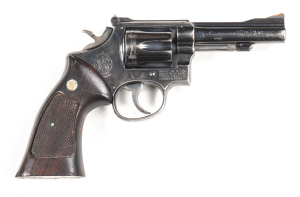 SMITH & WESSON MODEL18K 22 COMBAT R/F REVOLVER: 22R/F; 6 shot fluted cylinder; 102mm (4") barrel; vg bore; standard sights; S&W & Cal markings to barrel; Trademark, MADE IN USA & address to rhs of frame; sharp profiles & clear markings; retaining 95% blue