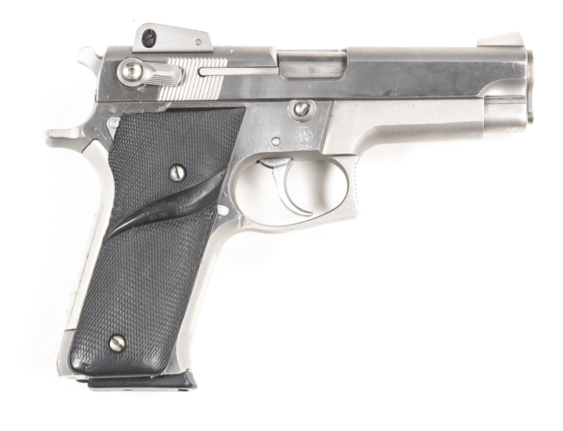 SMITH & WESSON MODEL 659 STAINLESS STEEL S/A PISTOL: 8MM; 14 shot mag; 102mm (4") barrel; vg bore; standard sights to slide & S&W MADE IN USA & address; S&W Trademark to rhs of frame; vg profiles with clear address & markings; polished finish to frame &