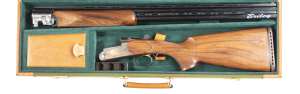 CASED FAUSTI LEADER O/U SPORTER SHOTGUN: 12G; single gold finished trigger; 2¾" chambers; 29" barrels with ventilated rib & ventilated between the barrels; fine bores; gun is new, unfired with a full blacked finish to the barrels; polished stainless steel