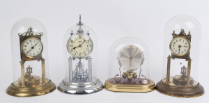 Four German 400 day anniversary clocks, comprising a "SCHATZ" with a nickel plated movement and case under a perspex dome; two other brass cased examples with rotary disk pendulums, each with off white glass dials with Arabic numerals; the fourth with sil