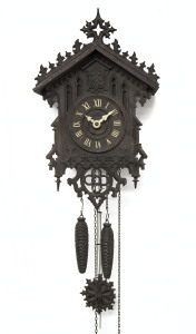 An antique Black Forest cuckoo clock with twin pinecone weight driven movement, 19th century, poor condition, a restorer's piece, the case 38cm high