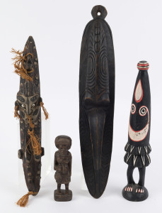 Group of four tribal artefacts and ornaments, Papua New Guinea and African, 20th century, the largest 45cm long