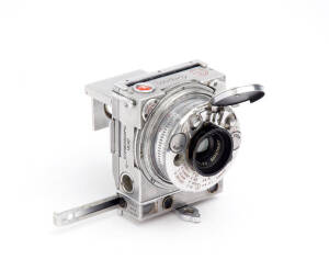 COMPASS CAMERA LTD (England): Compass Camera, c1938 [#1513], compact 35mm rangefinder camera with aluminium body incorporating many built-in features, with f3.5 35mm lens and a folding focusing magnifier on the ground-glass back.