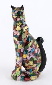 An American ceramic cat statue with rhinestone eyes, incised "M. J.", 16.5cm high