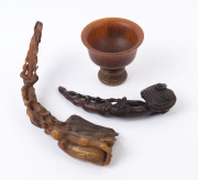 A carved horn wine cup, (19th century); together with a carved horn Ruyi sceptre with mushroom finial and Chi-Long dragon handle (19th century; as well as a carved horn sceptre adorned with leaves and peaches, (19th century), (3 items), the cup 9cm high,