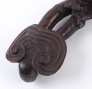 A carved horn wine cup, (19th century); together with a carved horn Ruyi sceptre with mushroom finial and Chi-Long dragon handle (19th century; as well as a carved horn sceptre adorned with leaves and peaches, (19th century), (3 items), the cup 9cm high, - 11