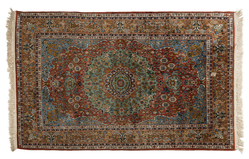 A Persian hand knotted silk rug, 20th century, 190 x 120cm