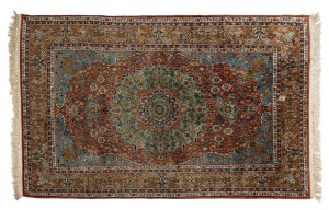 A Persian hand knotted silk rug, 20th century, 190 x 120cm