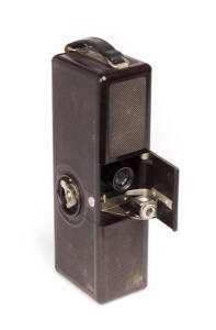 ELLISON KAMRA COMPANY (U.S.A.): Ellison Kamra, c1928, brown bakelite brick-shaped camera for bulk loads of 35mm film in special cassettes (2 present); with Wollensak f5 lens.
