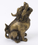 A Chinese bronze seated dragon statue, four character Ming mark but later; together with a Chinese two handled bronze censer with silver inlay, three character mark to base, 19th and 20th century, (2 items), statue 16cm high, censer 9cm high, 16cm wide - 2