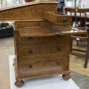 GILLOWS antique English burr walnut Davenport, handsomely fitted with pull-front writing slope, stationary drawer, ink and pen drawer and book rest slide. Original Bramah locks and keys with Gillows' signature melon feet with sunken casters. Stamped "GILL - 6