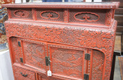 An antique Japanese red lacquered cabinet, profusely decorated on all sides. 18th century. 117cm high, 82cm wide, 34cm wide. PROVENANCE: Purchased from Spink & Son Ltd. London in 1927 for £200. formerly part of the Anderson Collection, England. - 7