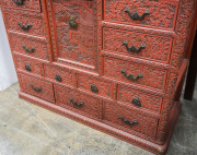 An antique Japanese red lacquered cabinet, profusely decorated on all sides. 18th century. 117cm high, 82cm wide, 34cm wide. PROVENANCE: Purchased from Spink & Son Ltd. London in 1927 for £200. formerly part of the Anderson Collection, England. - 9