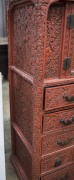 An antique Japanese red lacquered cabinet, profusely decorated on all sides. 18th century. 117cm high, 82cm wide, 34cm wide. PROVENANCE: Purchased from Spink & Son Ltd. London in 1927 for £200. formerly part of the Anderson Collection, England. - 10