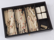 A Chinese marine ivory and bone Mah-jong set in a hardwood table cabinet with a sliding door opening to reveal five drawers with a complete set of hand painted pieces. The hardwood box has double bronze handles. Chinese character marks with the original o - 9