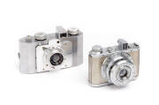 GALLUS (France): Derlux, c1947-52, folding polished aluminium camera [#10679] for 127 film; with Gallix f3.5 50mm lens and maker's ERC. Also, a TOAKOKI Gelto - DIII, c1950 with chrome and gold body and Grimmel f3.5 50mm lens. (2 cameras).