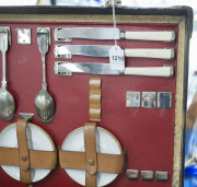 A stunning early automotive picnic set by "EDWARDS & SONS, REGENT STREET, LONDON", early 20th century, comprising stainless steel, enamel and silver plated cutlery, cannisters, warmers, containers etc., the case 62cm wide - 4