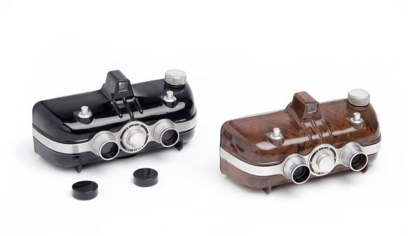 HANEEL TRI-VISION Co. (U.S.A.): Tri-Vision Stereo, c1949, plastic and aluminium stereo cameras for 28x30mm pairs on 828 rollfilm; one in marbled-brown finish; one in black (with lens caps). (2 cameras).