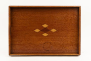 An Australian serving tray, silky oak with cedar and pine lozenge motif, Queensland origin, early 20th century, 53cm across the handles