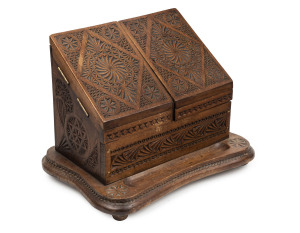 An Australian desk compendium, chip carved kauri pine, late 19th century, 29cm high, 39cm wide, 28cm deep