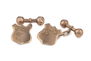 A.H. THOMAS pair of rose gold shield shaped cufflinks in original retailer's plush box marked "A.H. THOMAS THE LEADING JEWELLER, QUEENSTOWN", late 19th century, 8.5 grams total