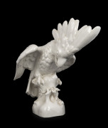 An antique white porcelain statue of a cockatoo, Austrian or German, 19th century, impressed marks to base (illegible), ​33cm high, 35cm wide