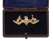 An Australian 9ct gold brooch with three boomerangs, kangaroo, emu and kookaburra, 19th century, ​4cm wide, 1.3 grams