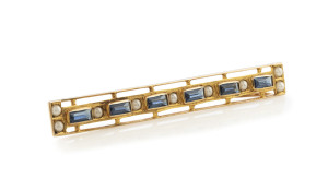 WILLIAM DRUMMOND & CO. Australian Art Deco gold bar brooch set with sapphires and seed pearls, circa 1925, in original plush fitted box, 6cm wide, 3.1 grams total