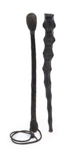 Two Australian police coshes, one with steel bar and weighted interior covered with animal tail leather hide, the second with a spiral whale baleen shaft with lead filled and woven bulb ends, with leather wrist strap, late 19th century, ​the largest 34cm 