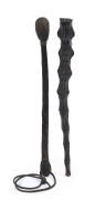 Two Australian police coshes, one with steel bar and weighted interior covered with animal tail leather hide, the second with a spiral whale baleen shaft with lead filled and woven bulb ends, with leather wrist strap, late 19th century, ​the largest 34cm