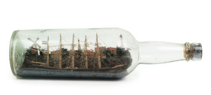 An antique clipper ship in a bottle set in fine diorama harbour scene, 19th century, 30cm long