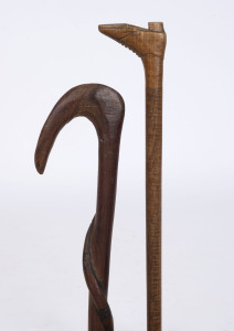 An antique Australian fiddleback blackwood walking stick with boot handle; together with an Aboriginal carved snake example, 19th and 20th century, (2 items) 89cm and 82cm high