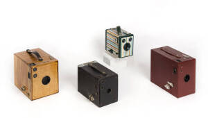 KODAK: A group of box cameras comprising a Rainbow Hawk-Eye No.2A Model B in reddish-brown; a Brownie No.3 Model B All Wood camera; a No.2 Brownie in black; and, a Six-20 Brownie with multi-coloured finish. (4 cameras).