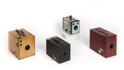 KODAK: A group of box cameras comprising a Rainbow Hawk-Eye No.2A Model B in reddish-brown; a Brownie No.3 Model B All Wood camera; a No.2 Brownie in black; and, a Six-20 Brownie with multi-coloured finish. (4 cameras).