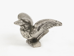 A kookaburra statue with raised wings, cast metal and chrome, early 20th century, 9cm across the wings