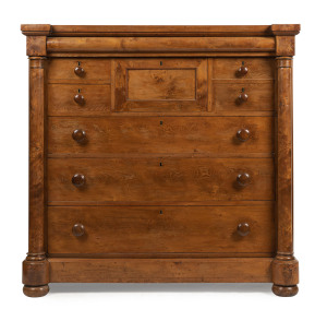 A Colonial huon pine chest of seven drawers, inverted breakfront with full turned columns and cushion moulded long drawer; birdseye huon pine with cedar and huon pine secondary timbers, Tasmanian origin, circa 1850. Note: Unusual drawer configuration. 128cm high, 131cm wide, 61cm deep