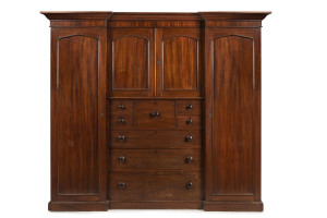 A fine Colonial Beaconsfield gentleman's wardrobe with inverted breakfront, Australian cedar with huon pine secondary timbers and blackwood knobs, Tasmanian origin, circa 1850. Bearing label on the back "A. JONES, LAUNCESTON". 203cm high, 220cm wide, 70cm deep.