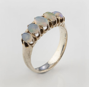 A white gold ring set with a row of five cabochon jellybean opals, 20th century,