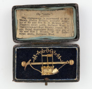 A rare "MALCOLM" Western Australian goldfields brooch, late 19th century, housed in a period plush box with a Ballarat newspaper clipping, 5.5cm wide, 5.6 grams. Illustrated in "GOLD & SILVERSMITHING IN WESTERN AUSTRALIA" by Dorothy Erickson [U.W.A. Press - 3