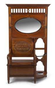 ROJO antique Australian blackwood hall stand with lift-top storage box base, umbrella stand, carved panel and oval mirror, Melbourne, Victorian origin, circa 1910, maker's ink stamp to interior, 204cm high, 118cm wide, 40cm deep