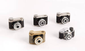 KUNIK: Petie sub-miniature cameras (4), c1956, for 16 exposures, 14x14mm on 16mm film; includes a Petie-Gold in maker's leather ERC. Also, a Q.P."hit-type" sub-miniature camera with ERC in maker's box. (5 cameras).