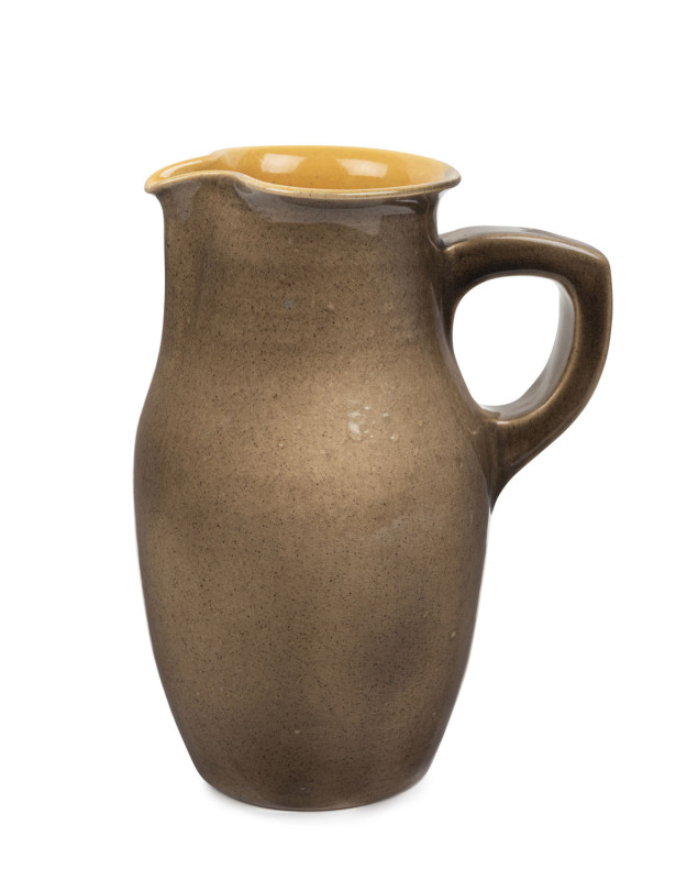 KLYTIE PATE brown glazed pottery pitcher with yellow glazed interior, incised "Klytie Pate", 23cm high